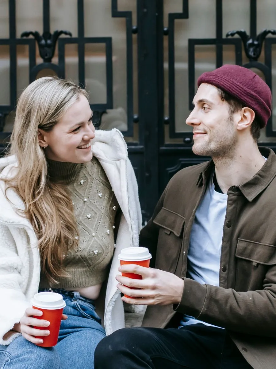 Smiling man and woman on a coffee date