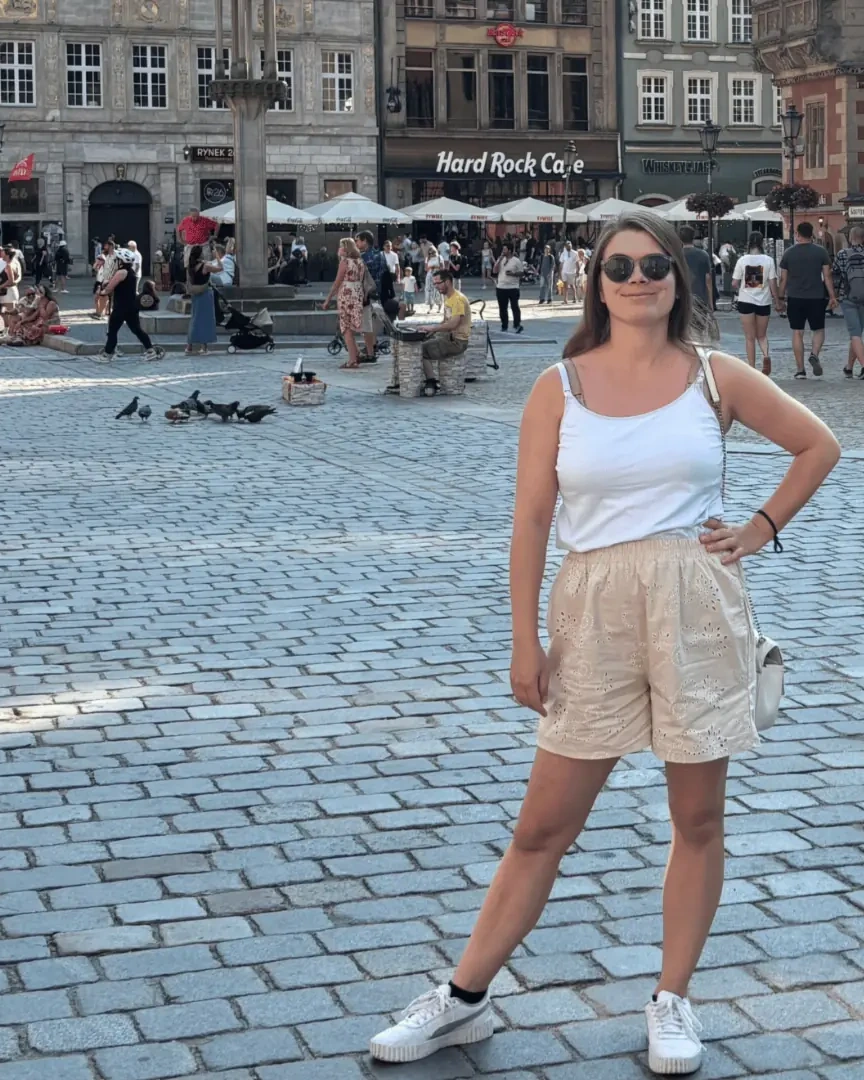 Weronika standing in Wrocław's Market Square