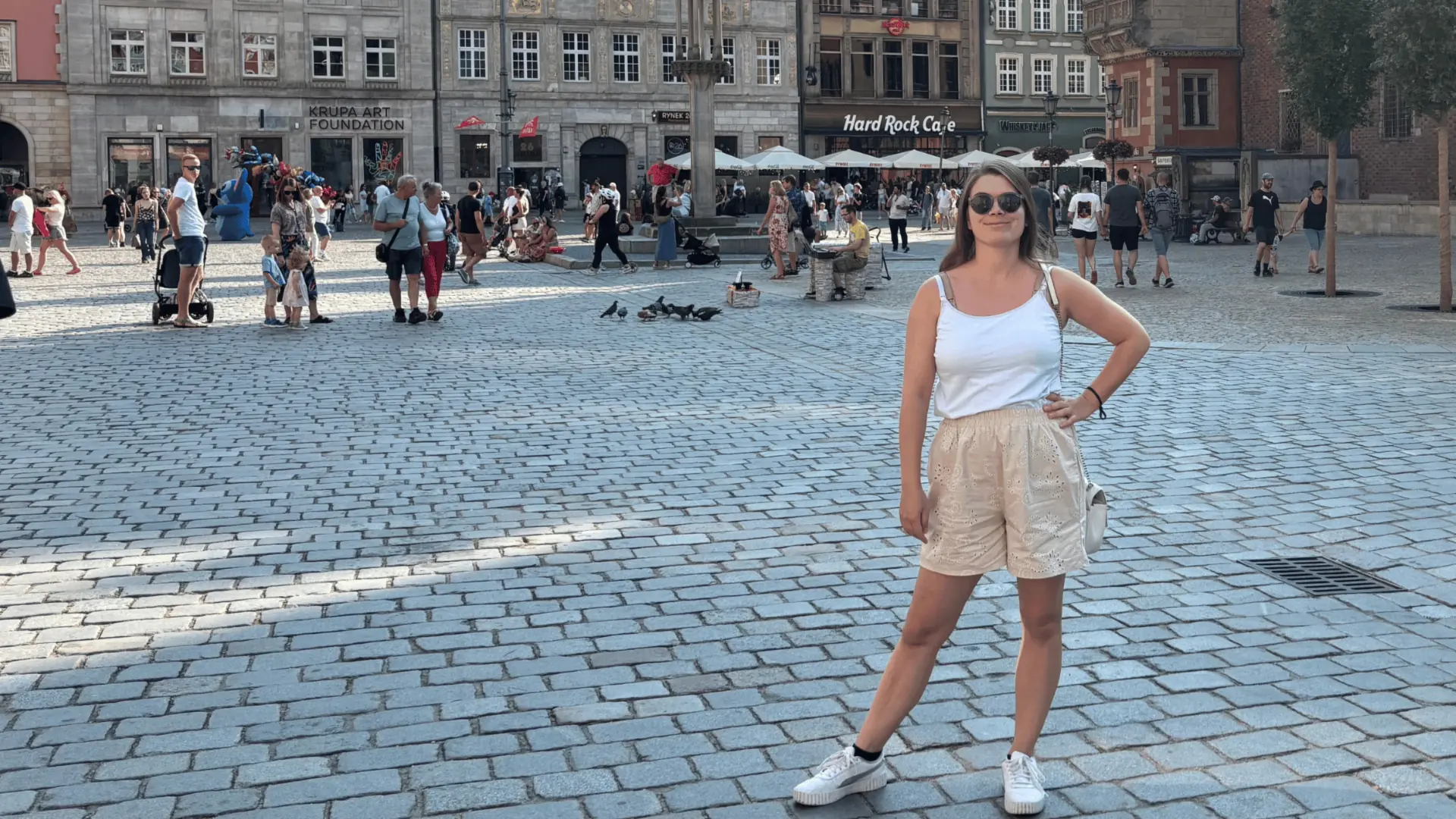 Weronika standing in Wrocław's Market Square